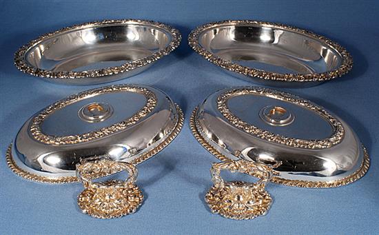 A pair of ornate Victorian oval silver plated entrée dishes with covers, length 278mm.